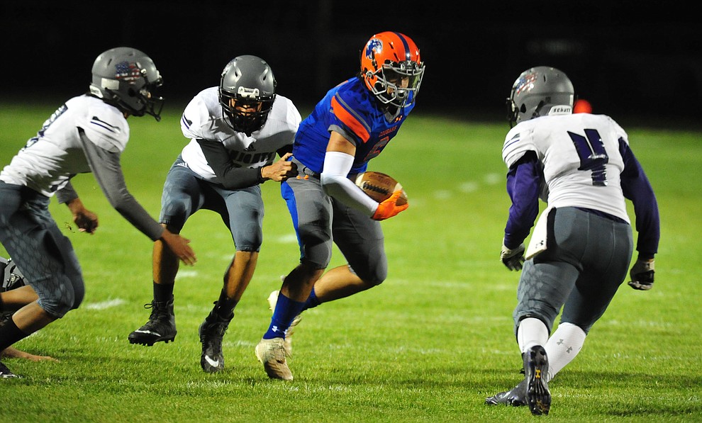 Chino Valley's Elijah Scordato looks for running room as the Cougars host Arizona College Prep Friday, Sept. 14, 2018. (Les Stukenberg/Courier)