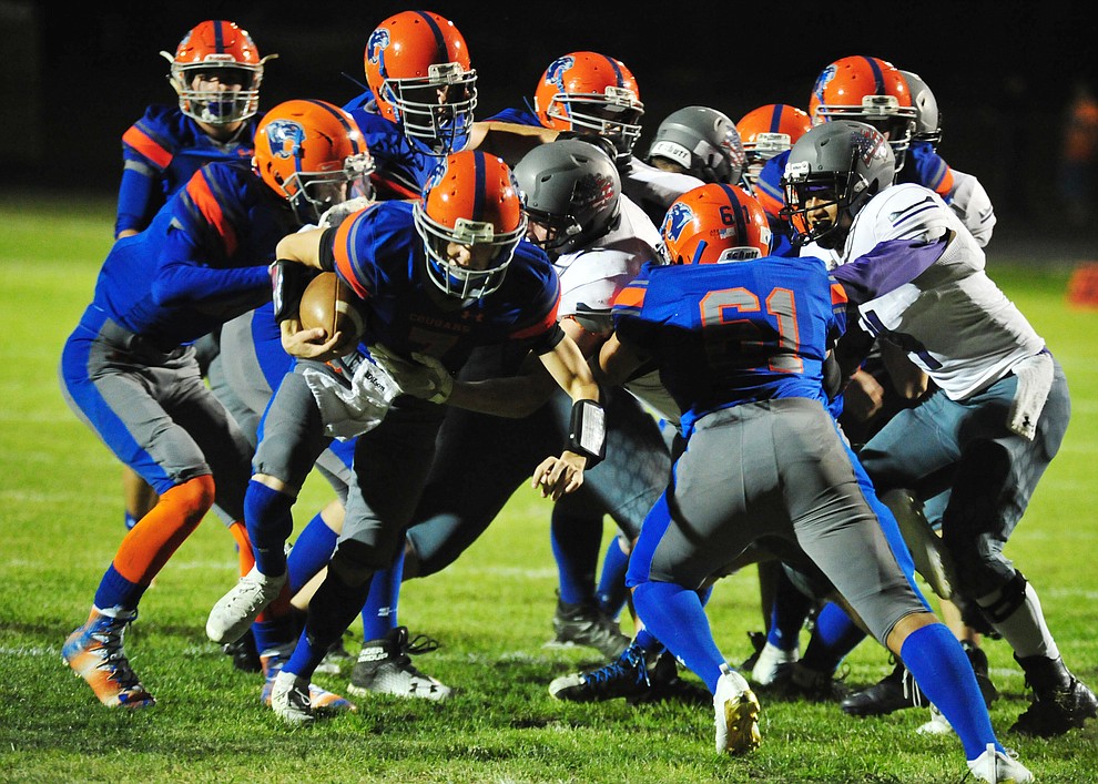 Chino Valley's Tyler Carey has a convoy of blockers as the Cougars host Arizona College Prep Friday, Sept. 14, 2018. (Les Stukenberg/Courier)