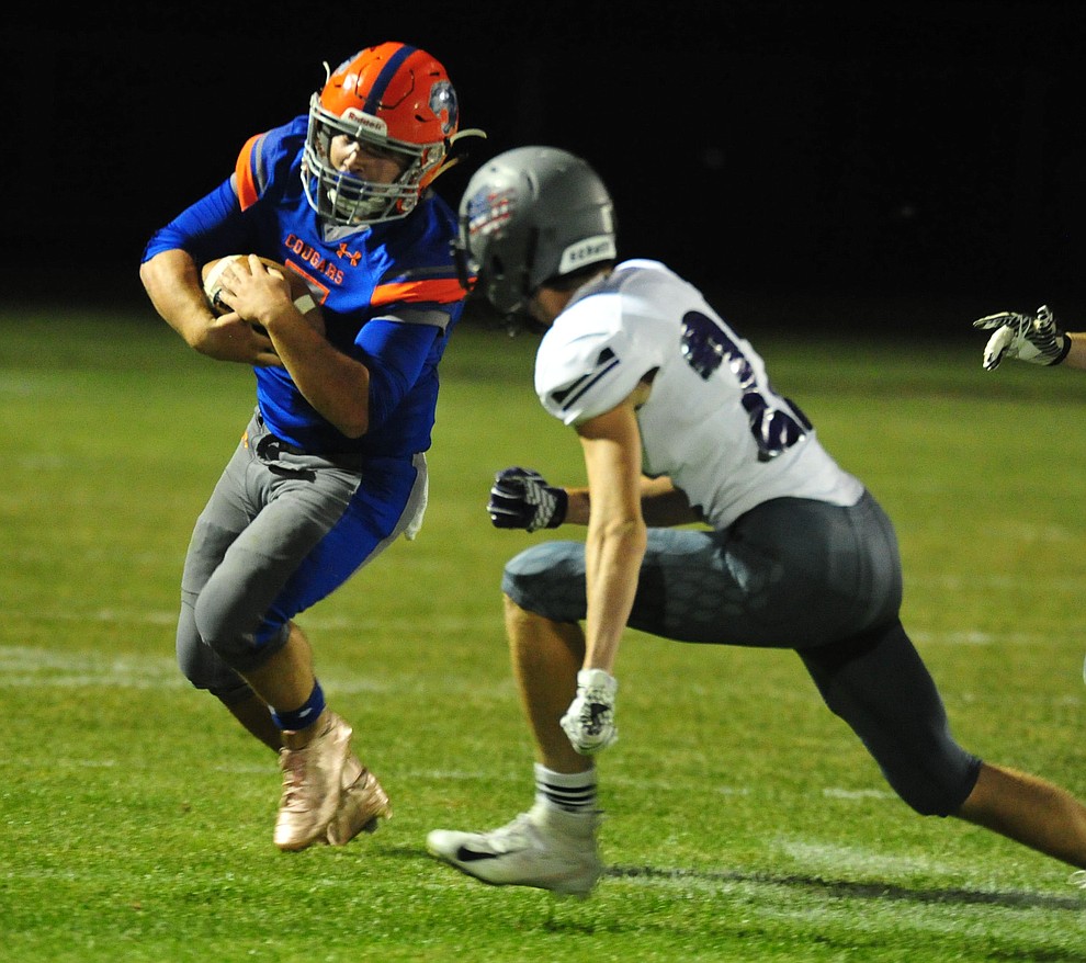 Chino Valley's Mikey Paulus gets a big gain to end the first half as the Cougars host Arizona College Prep Friday, Sept. 14, 2018. (Les Stukenberg/Courier)