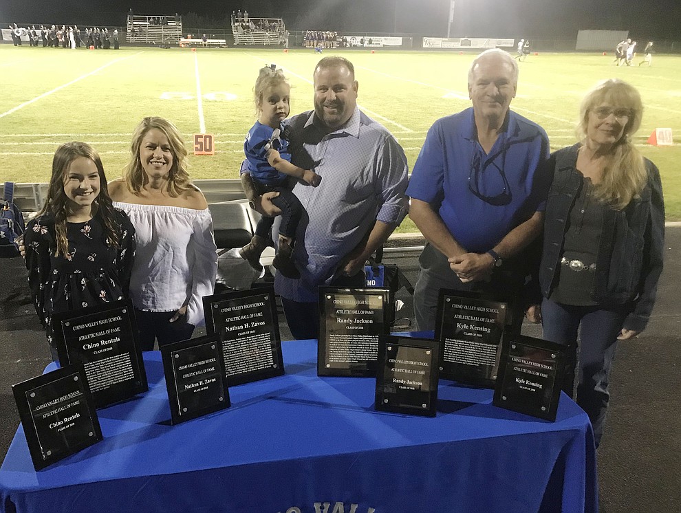 Marley and Cheyenne Tenberge representing Chino Rentals, Randy Jackson, Gary and Karen Kensing represnting their son Kyle and not pictured Nathan Zavos were inducted into the Chino Valley High School Hall of Fame Friday Sept. 14, 2018 at halftime of the home football against Arizona College Prep. (Les Stukenberg/Courier)
