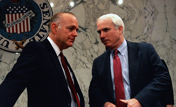 Sen. Dennis DeConcini (D-Ariz.), left, speaks with Sen. John S. McCain (R-Ariz.) before a meeting of the Senate Select Committee on Indian Affairs on Capitol Hill, Feb. 7, 1989. The committee is investigating allegations of fraud and mismanagement on reservations and in federal Indian programs. (John Duricka/AP Photo file)