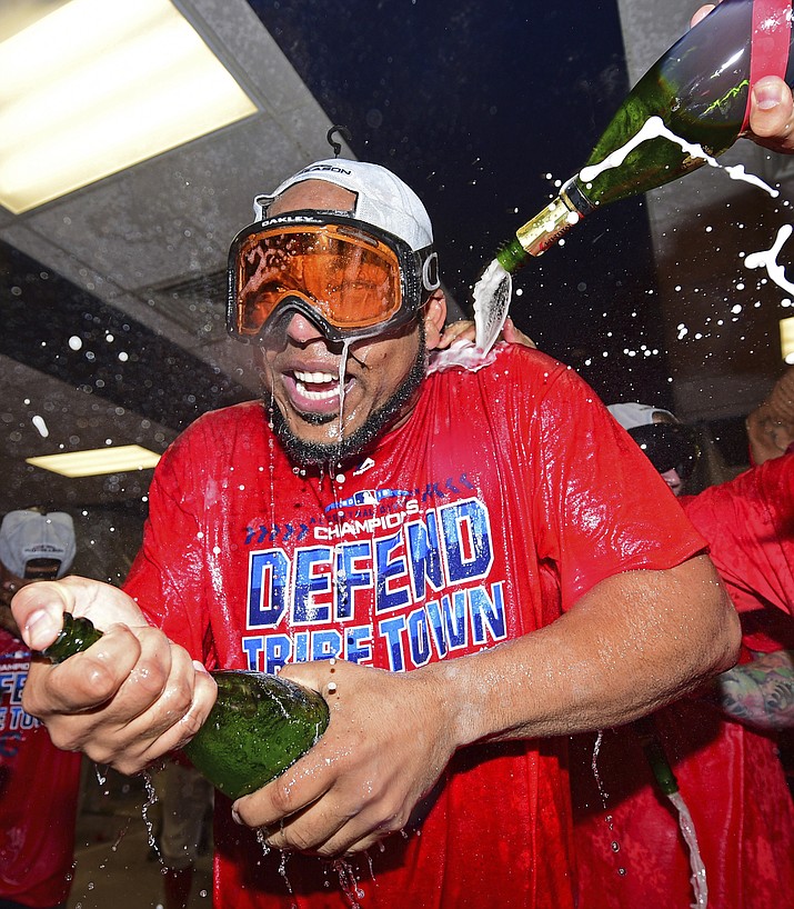Indians’ Edwin Encarnacion celebrates in the clubhouse after the Indians defeated the Detroit Tigers 15-0 to clinch the American League Central Division Saturday, Sept. 15, 2018, in Cleveland. (David Dermer/AP)