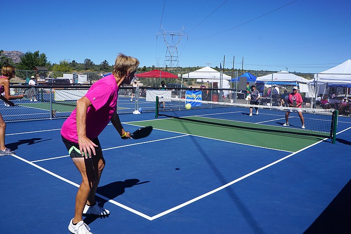Local pickleball player Sue Brogaard strikes the ball during women’s doubles play at the Pioneer Park pickleball courts Friday morning, Sept. 14. Brogaard was among the 200 or so competitors to take part in the Prescott Mile High Matchup tournament — one of the growing number of events scheduled at the courts. (Cindy Barks/Courier)