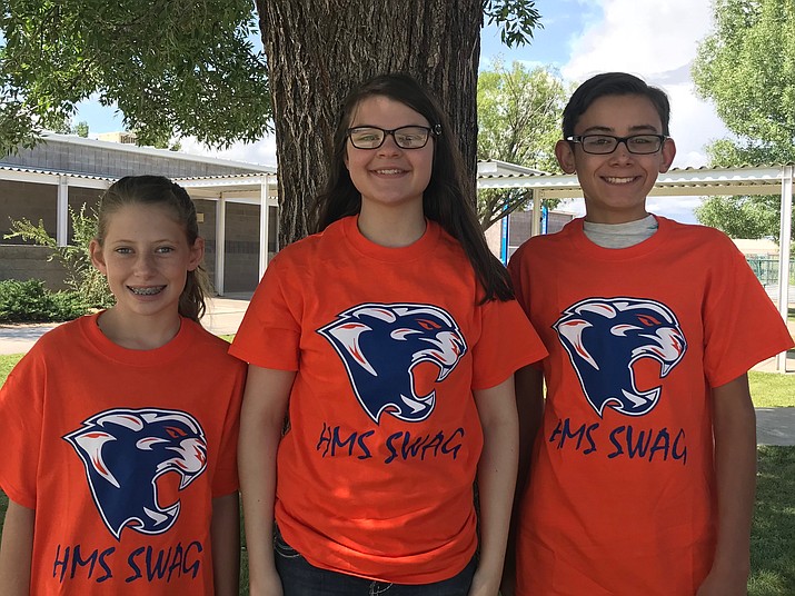 Three unnamed students from Heritage Middle School show off their SWAG T-shirts after the annual awards assembly in August. (CVUSD/Courtesy)