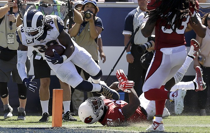 Los Angeles Rams running back Todd Gurley scores past Arizona Cardinals defensive back Patrick Peterson during the first half of an NFL football game Sunday, Sept. 16, 2018, in Los Angeles. (Marcio Jose Sanchez/AP)