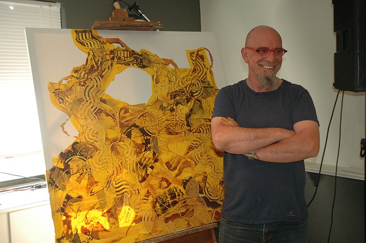 French Painter Yves Cairoli stands with the artwork he created during “The French Connection: Up Close and Personal” event that officially kicked off the second annual Voila Tour earlier this year. (Jason Wheeler/Courier)
