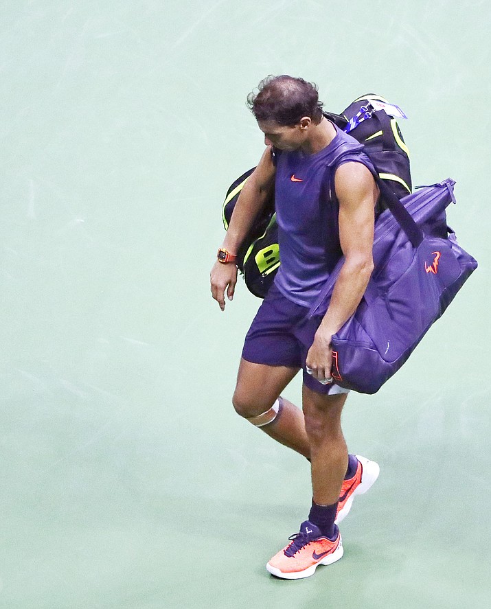 Rafael Nadal leaves the court after retiring from a match against Juan Martin del Potro, during the semifinals of the U.S. Open tennis tournament, Friday, Sept. 7, 2018, in New York. (Frank Franklin II/AP)