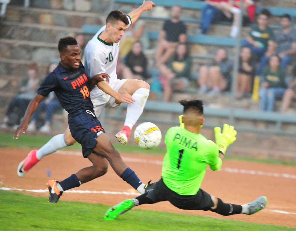 Yavapai's Daniel Mulholland (10) drives for the goal between a pair of defenders as the Roughriders take on the Pima Community College Aztecs Thursday, Sept. 20, 2018 at Ken Lindley Field in Prescott.(Les Stukenberg/Courier)