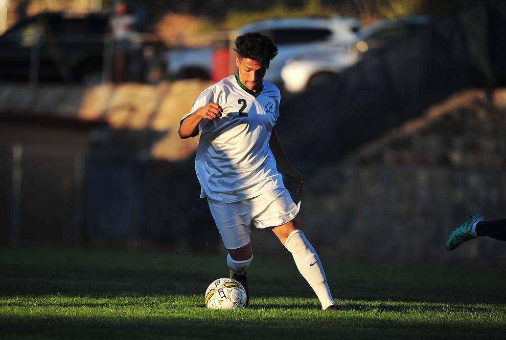 Yavapai's Jesus Vargas (2) drives through a ray of sunlight as the Roughriders take on the Pima Community College Aztecs Thursday, Sept. 20, 2018 at Ken Lindley Field in Prescott.(Les Stukenberg/Courier)