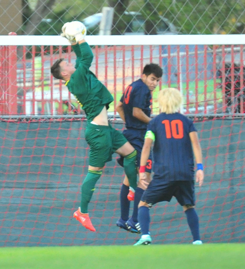 Yavapai's Tyler Trump makes a save as the Roughriders take on the Pima Community College Aztecs Thursday, Sept. 20, 2018 at Ken Lindley Field in Prescott.(Les Stukenberg/Courier)