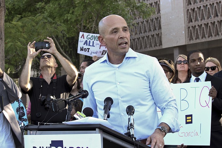 Democrat David Garcia announces his run for Arizona governor at the state Capitol in Phoenix on April 12, 2017. The Republican Governors Association has unveiled a fourth ad targeting the immigration policies of Garcia, labeling him as a radical who is "liberal on illegal immigration" who wants to "abolish ICE." (Bob Christie/AP file)