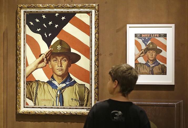 In this July 22, 2013, file photo, Andrew Garrison, 11, of Salt Lake City, looks over the Rockwell exhibition at the Mormon Church History Museum in Salt Lake City, Utah. The Mormon church's new youth program it will roll out in 2020 when it cuts all ties with Boy Scouts of America will still include outdoor and adventure activities even as the initiative becomes more gospel-focused, the faith confirmed Friday, Sept. 21, 2018. (Rick Bowmer/AP, File)

