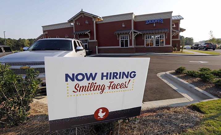 This July 25, 2018, photo shows a help wanted sign at a new Zaxby's restaurant in Madison, Miss. (Rogelio V. Solis/AP file)