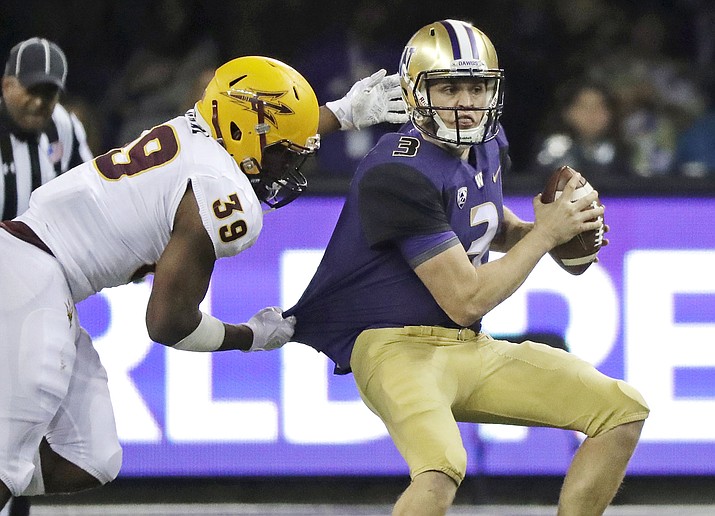 Washington quarterback Jake Browning is sacked by Arizona State linebacker Malik Lawal (39) during the first half of an NCAA college football game Saturday, Sept. 22, 2018, in Seattle. (Ted S. Warren/AP)
