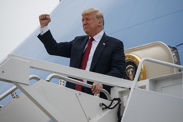 President Donald Trump gestures as he arrives at Springfield-Branson National Airport on Sept. 21, 2018, before attending a campaign rally in Springfield, Mo. (Evan Vucci/AP file)