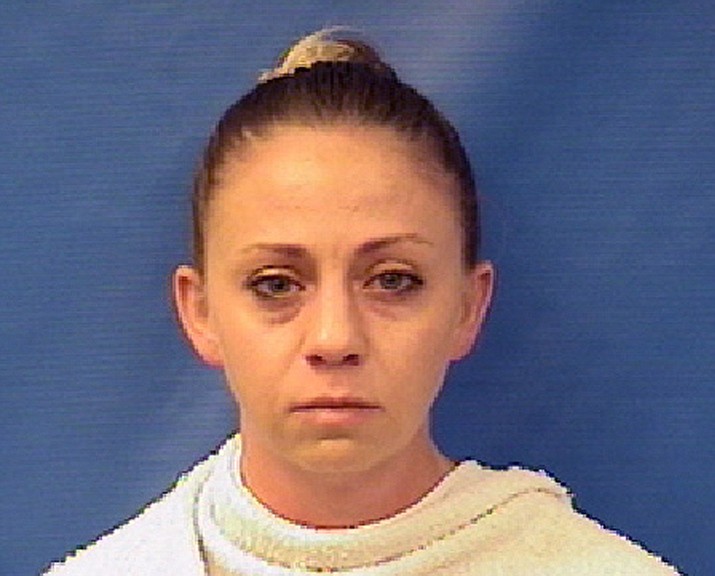 This file photo provided by the Kaufman County Sheriff's Office shows Amber Renee Guyger. Guyger, a Dallas police officer accused of fatally shooting her neighbor inside his own apartment has been dismissed, the police department announced Monday, Sept. 24, 2018. The Dallas Police Department fired Guyger weeks after she fatally shot 26-year-old Botham Jean inside his own apartment on Sept. 6. Court records show Guyger said she thought she had encountered a burglar inside her own home.(Kaufman County Sheriff's Office via AP, File)
