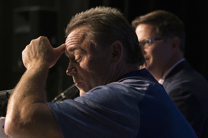 Toronto Blue Jays manager John Gibbons, foreground, attends a press conference with Blue Jays general manager Ross Atkins in Toronto, Wednesday, Sept. 26, 2018. Gibbons will not return to the Toronto Blue Jays in 2019, ending his second run with the club. The Blue Jays made the long-expected announcement on Wednesday, ahead of Toronto's final home game of the season against the Houston Astros. (Chris Young/The Canadian Press via AP)