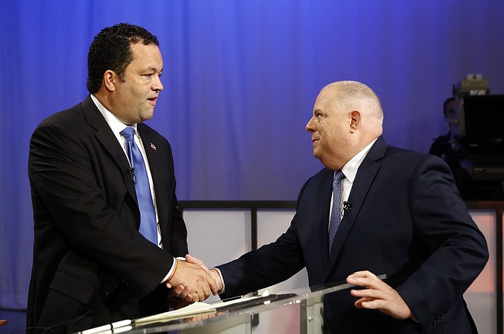 In this Monday, Sept. 24, 2018 file photo, Maryland Democratic gubernatorial candidate Ben Jealous, left, and Republican candidate, Maryland Gov. Larry Hogan, shake hands before participating in a debate at Maryland Public Television's studios in Owings Mills, Md. Some Republican governors are calling for a delay in the U.S. Senate confirmation vote on Supreme Court nominee Brett Kavanaugh. Governors have no official say in whether Kavanaugh will be confirmed. But their statements could help pressure senators and separate themselves from President Donald Trump as they seek re-election. That might be especially important in Democratic-leaning states such as Maryland, Massachusetts and Vermont. (Patrick Semansky/AP, File)

