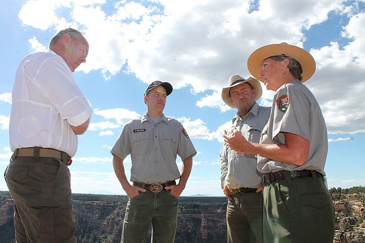 Interior Secretary Ryan Zinke talks with Grand Canyon Superintendent Chris Lehnertz and two members of the trails crew about staffing concerns. (Erin Ford/WGCN)