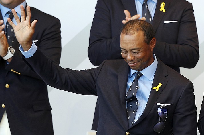 Tiger Woods of the US acknowledges the crowd after being introduced during the opening ceremony of the Ryder Cup at Le Golf National in Saint-Quentin-en-Yvelines, outside Paris, France, Thursday, Sept. 27, 2018. The 42nd Ryder Cup will be held in France from Sept. 28-30, 2018 at Le Golf National. (Francois Mori/AP)