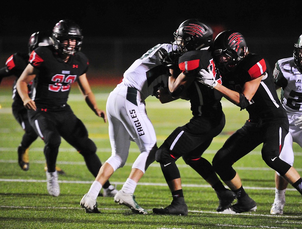 Bradshaw Mountain's defenders stack up a runner as the Bears take on the Flagstaff Eagles Friday, Sept. 28, 2018 in Prescott Valley. (Les Stukenberg/Courier)