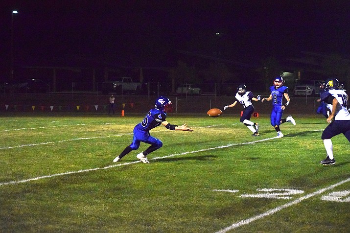 Sophomore Matt Loza Catches the ball Friday during a game against Glendale Prep. The  No. 27 Cowboys (3-3, 1-0 Verde) overcame a 14-0 deficit to defeat Glendale Prep 22-14 at home. VVN/James Kelley
