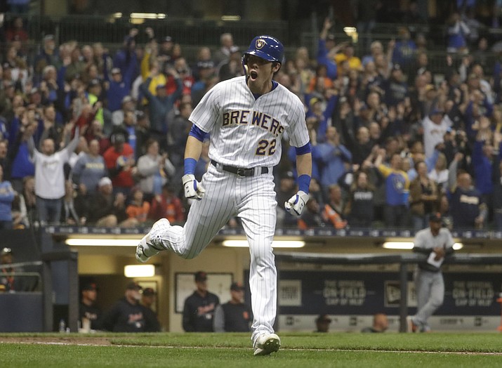 Milwaukee Brewers' Christian Yelich celebrates after hitting a home run during the seventh inning of a baseball game against the Detroit Tigers Saturday, Sept. 29, 2018, in Milwaukee. (Morry Gash/AP)