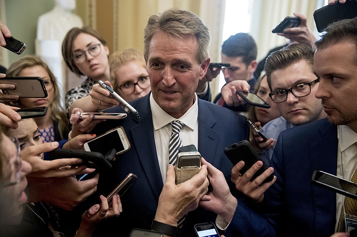 Sen. Jeff Flake, R-Ariz., center, speaks with reporters Sept. 28, 2018, after meeting with Senate Majority Leader Mitch McConnell of Kentucky in his office in the Capitol in Washington. Flake is stoking new speculation about a possible presidential run as he emerges as a central figure in the explosive debate over President Donald Trump's Supreme Court pick. (Andrew Harnik/AP)