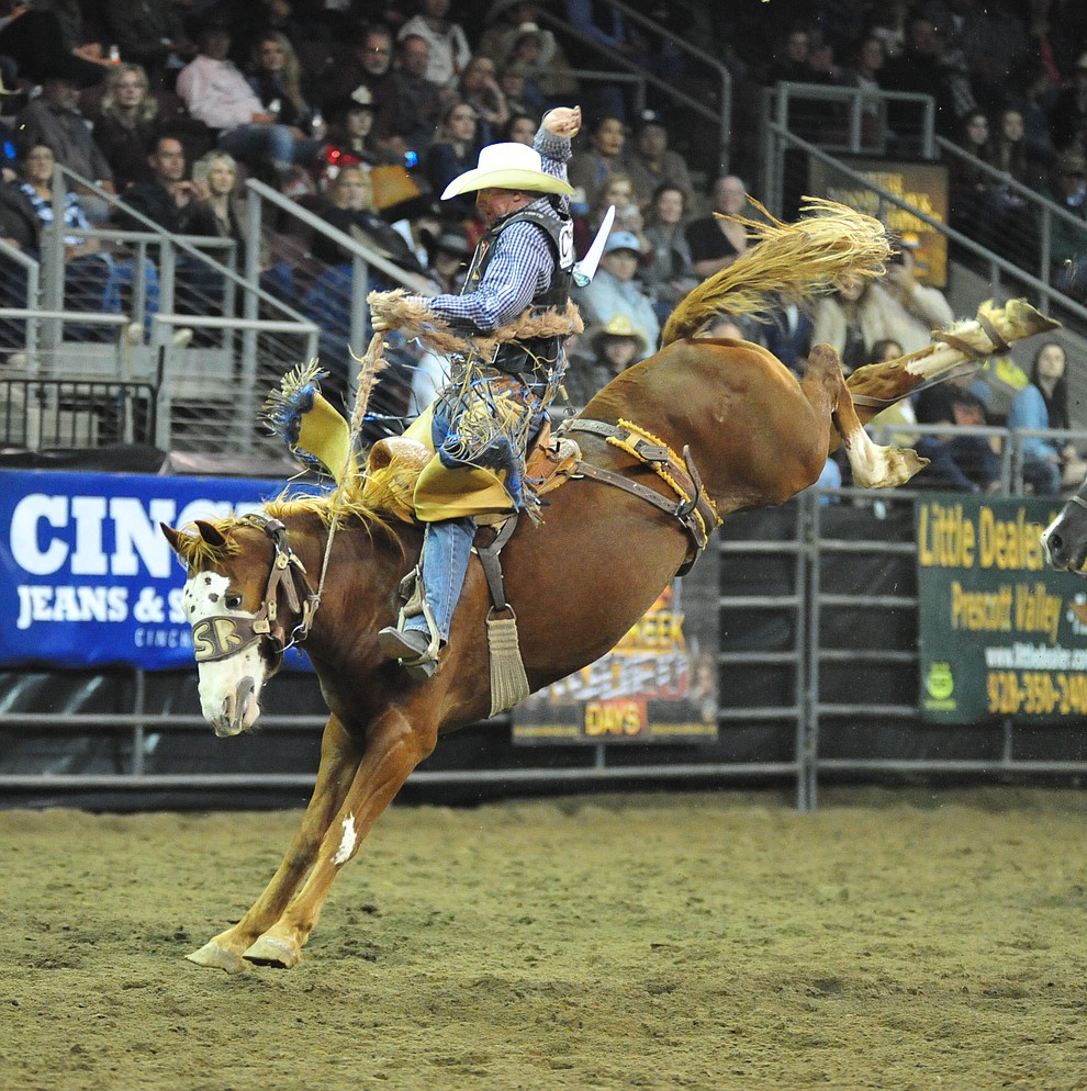 Taos Muncy on Buckshot scores 79.5 in the saddle bronc riding at the Turquoise Circuit Final Rodeo Saturday, Oct. 6, 2018 at the Prescott Valley Event Center. (Les Stukenberg/Courier)