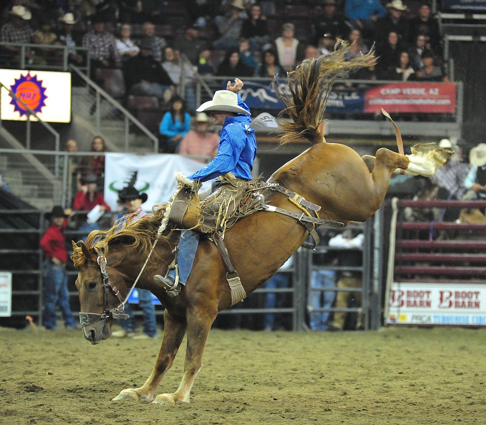 Ross Griffin scores 75 on Out of the Blue in the saddle bronc riding at the Turquoise Circuit Final Rodeo Saturday, Oct. 6, 2018 at the Prescott Valley Event Center. (Les Stukenberg/Courier)