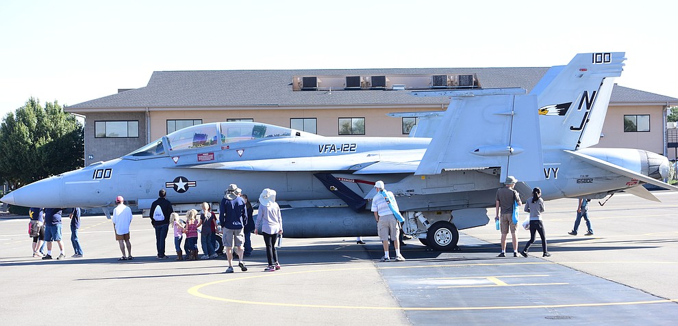 Visitors get an up close look at a F/A 18-F during the Wings Out West Airshow at Prescott Regional Airport Saturday, Oct. 6, 2018. (Les Stukenberg/Courier)