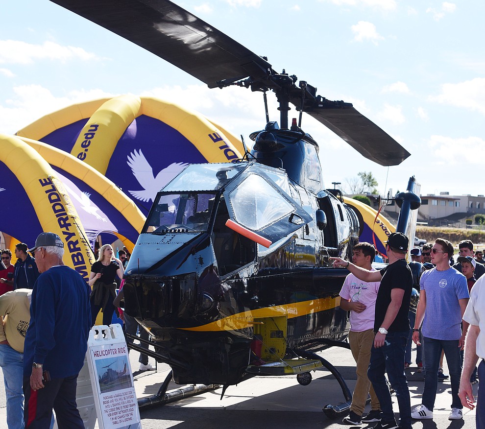 People get an up close look at a Cobra helicopter during the Wings Out West Airshow at Prescott Regional Airport Saturday, Oct. 6, 2018. (Les Stukenberg/Courier)