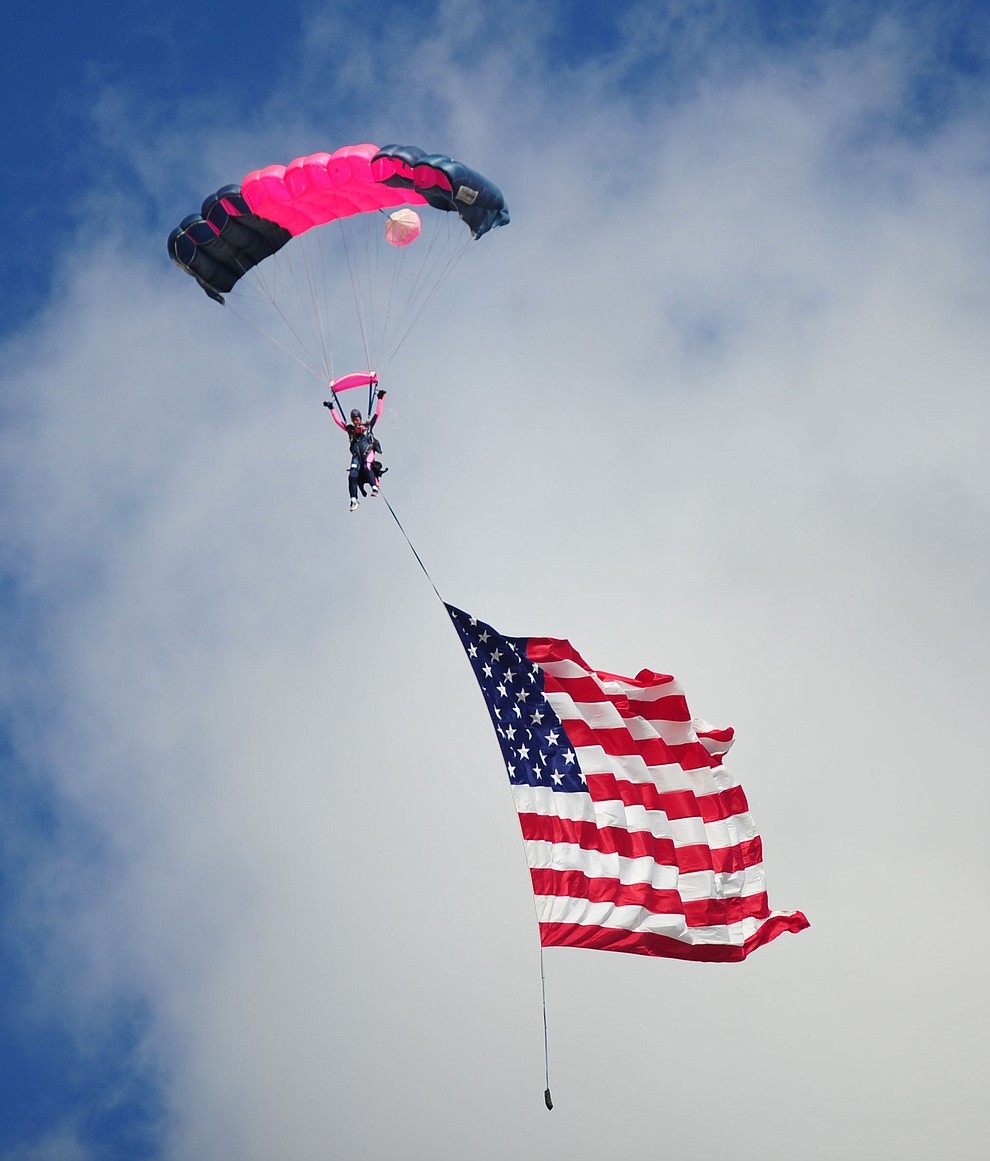 Cindy Irish flies in the American Flag during the Wings Out West Airshow at Prescott Regional Airport Saturday, Oct. 6, 2018. (Les Stukenberg/Courier)