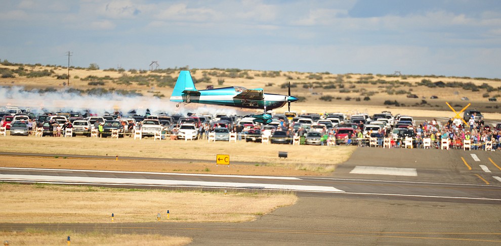 Bill Stein flys his Edge 540 just off the runway during the Wings Out West Airshow at Prescott Regional Airport Saturday, Oct. 6, 2018. (Les Stukenberg/Courier)