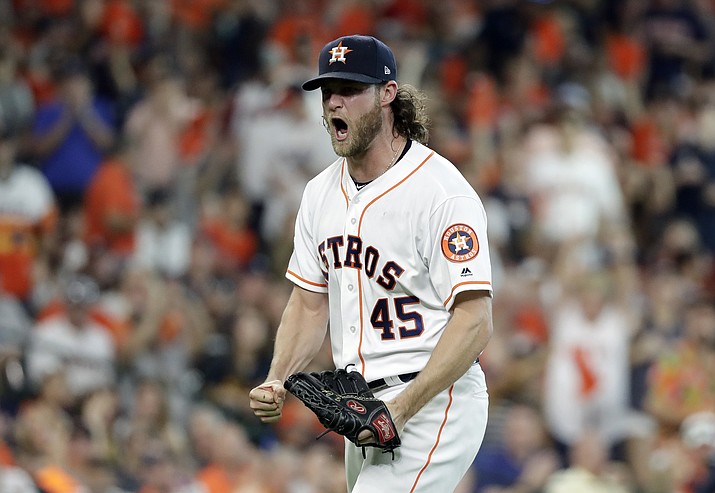 Houston Astros starting pitcher Gerrit Cole (45) reacts after striking out Cleveland Indians’ Jose Ramirez to end the sixth inning of Game 2 of a baseball American League Division Series, Saturday, Oct. 6, 2018, in Houston. (David J. Phillip/AP)

