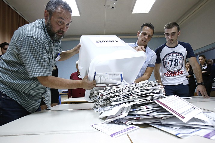Bosnian election workers prepare to count ballots at a polling station in Sarajevo, Bosnia, on Sunday, Oct. 7, 2018. Bosnians decide in a tense election this weekend whether to cement the ethnic divisions stemming from the 1992-95 war by supporting nationalist politicians or push for changes that would pave the way toward European Union and NATO integration. (Amel Emric/AP)