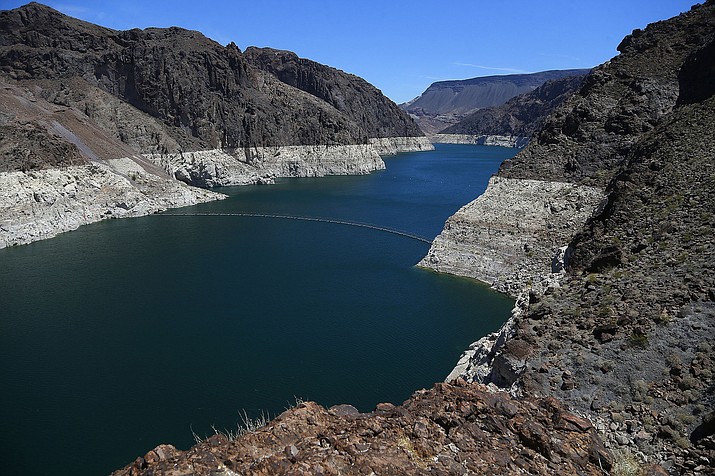 The low level of the water line is shown May 31, 2018, on the banks of the Colorado River in Hoover Dam. Seven Southwestern U.S. states that depend on the overtaxed river say they have reached tentative agreements on managing the waterway amid an unprecedented drought. (Ross D. Franklin/AP file)