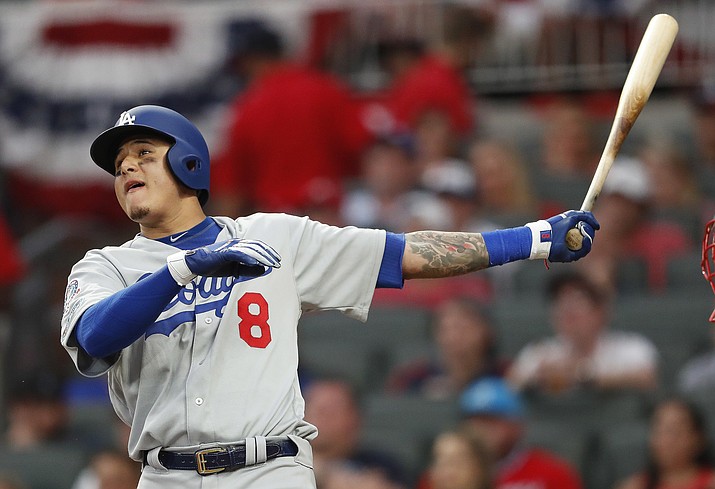 Los Angeles Dodgers shortstop Manny Machado (8) watches his three-run homer against the Atlanta Braves during the seventh inning in Game 4 of baseball’s National League Division Series, Monday, Oct. 8, 2018, in Atlanta. (John Bazemore/AP)