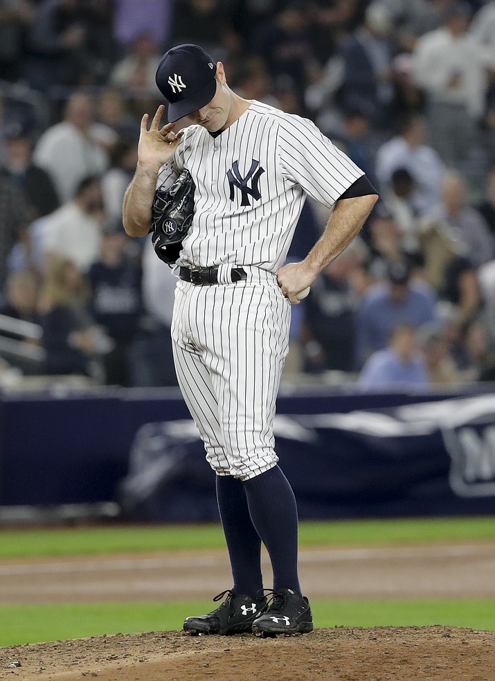 New York Yankees relief pitcher David Robertson reacts as he waits to be relieved during the seventh inning of Game 4 of baseball’s American League Division Series against the Boston Red Sox, Tuesday, Oct. 9, 2018, in New York. (Frank Franklin II/AP)