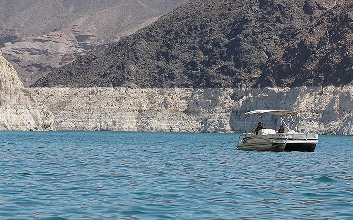 Mineral deposits on the rock formations in Lake Mead, the largest reservoir on the Colorado River, show the impact of a decades-long drought on water levels. Hydrologists fear the reservoir will drop to the level at which no water can be released – a situation known as “dead pool.” (File photo by Alexis Kuhbander/Cronkite News)