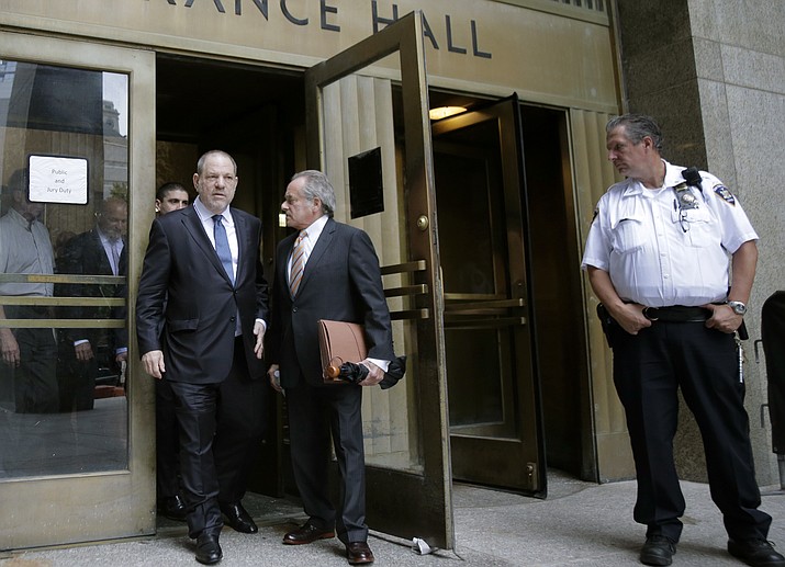 Harvey Weinstein, left, leaves court with his attorney Benjamin Brafman in New York, Thursday, Oct. 11, 2018. Manhattan’s district attorney dropped part of the criminal sexual assault case against Weinstein on Thursday after evidence emerged that cast doubt on the account one of his three accusers provided to the grand jury.(Seth Wenig/AP)