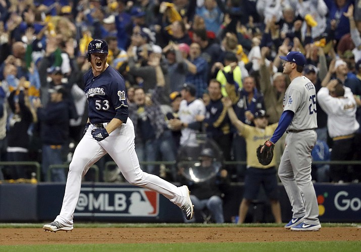 Milwaukee Brewers’ Brandon Woodruff (53) celebrates after hitting a home run during the third inning of Game 1 of the National League Championship Series baseball game against the Los Angeles Dodgers Friday, Oct. 12, 2018, in Milwaukee. (Jeff Roberson/AP)