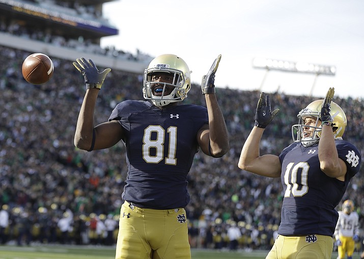 Notre Dame's Miles Boykin (81) celebrates after making the game winning catch with Chris Finke (10) during the second half of an NCAA college football game against Pittsburgh, Saturday, Oct. 13, 2018, in South Bend, Ind. Notre Dame won 19-14. (Darron Cummings/AP)