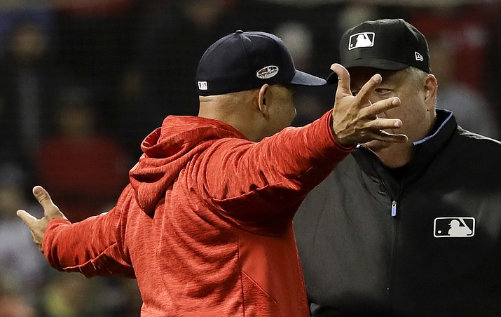 Boston Red Sox manager Alex Cora argues a strike three call with umpire Joe West during the fifth inning in Game 1 of a baseball American League Championship Series against the Houston Astros on Saturday, Oct. 13, 2018, in Boston. (David J. Phillip/AP)