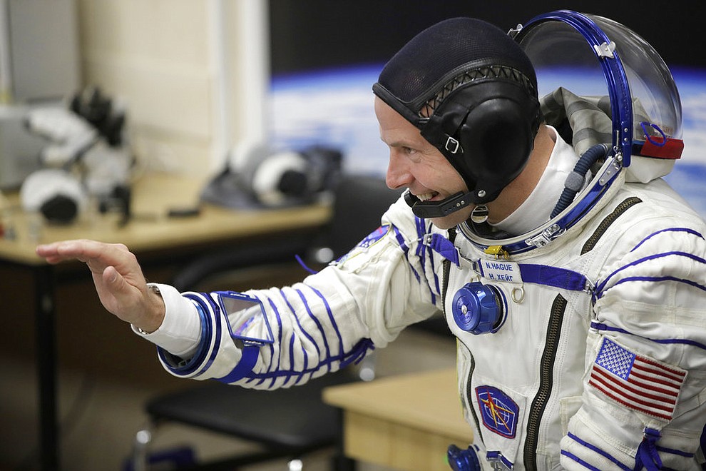 U.S. astronaut Nick Hague, a member of the main crew of the expedition to the International Space Station (ISS), gestures prior to the launch of Soyuz MS-10 space ship at the Russian leased Baikonur cosmodrome, Kazakhstan, Thursday, Oct. 11, 2018. (AP Photo/Dmitri Lovetsky)