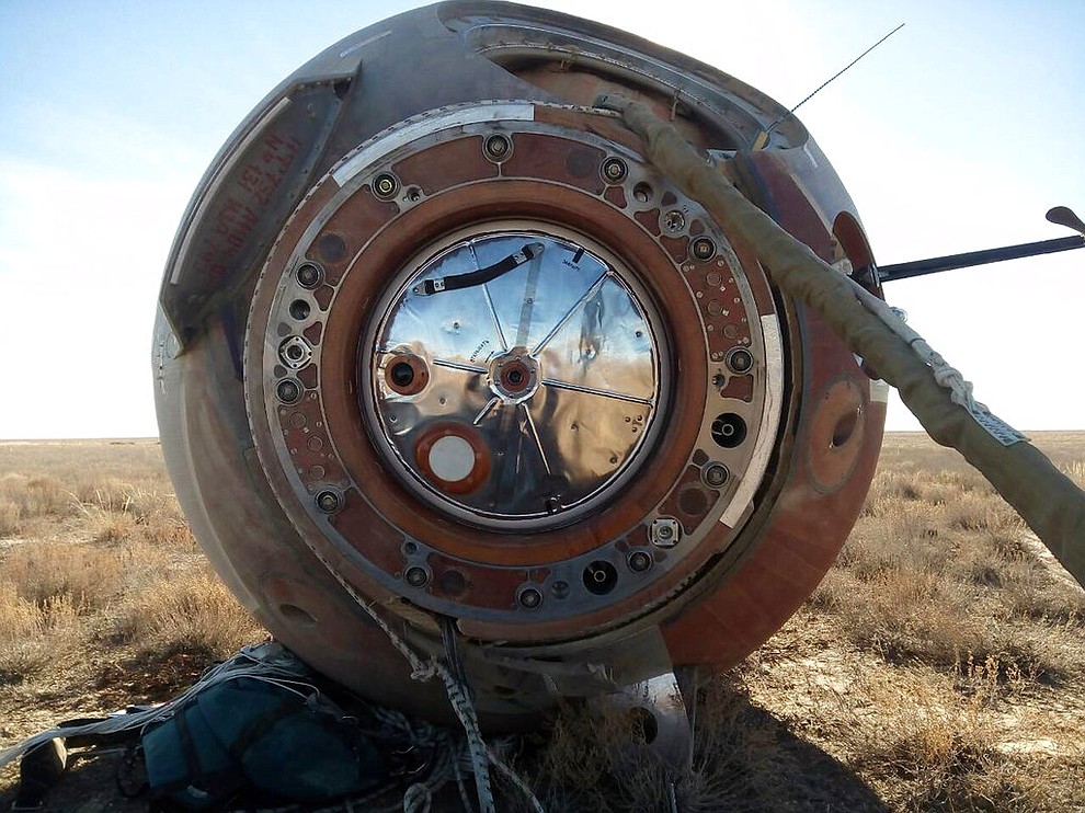 In this photo provided by Russian Defense Ministry Press Service, the Soyuz MS-10 space capsule lays in a field after an emergency landing near Dzhezkazgan, about 450 kilometers (280 miles) northeast of Baikonur, Kazakhstan, Thursday, Oct. 11, 2018. NASA astronaut Nick Hague and Roscosmos' Alexei Ovchinin lifted off as scheduled at 2:40 p.m. (0840 GMT; 4:40 a.m. EDT) Thursday from the Russian-leased Baikonur cosmodrome in Kazakhstan, but their Soyuz booster rocket failed about two minutes after the launch. (Russian Defense Ministry Press Service photo via AP)