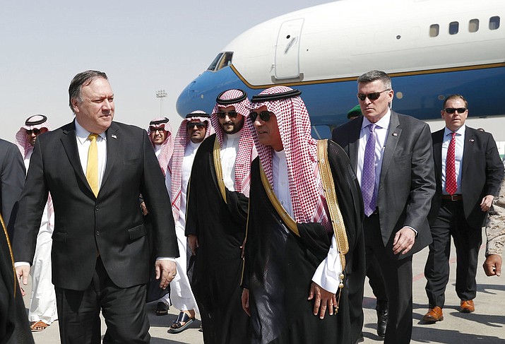 U.S. Secretary of State Mike Pompeo, left, walks with Saudi Foreign Minister Adel al-Jubeir, after arriving in Riyadh, Saudi Arabia, Tuesday Oct. 16, 2018. Pompeo arrived Tuesday in Saudi Arabia for talks with King Salman over the unexplained disappearance and alleged slaying of Saudi writer Jamal Khashoggi, who vanished two weeks ago during a visit to the Saudi Consulate in Istanbul.(Leah Millis/Pool via AP)