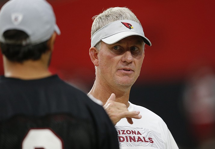 Eleven months after he was fired as offensive coordinator in Denver, Mike McCoy is on shaky ground as offensive coordinator of the punchless Arizona Cardinals. (Ross D. Franklin/AP file)