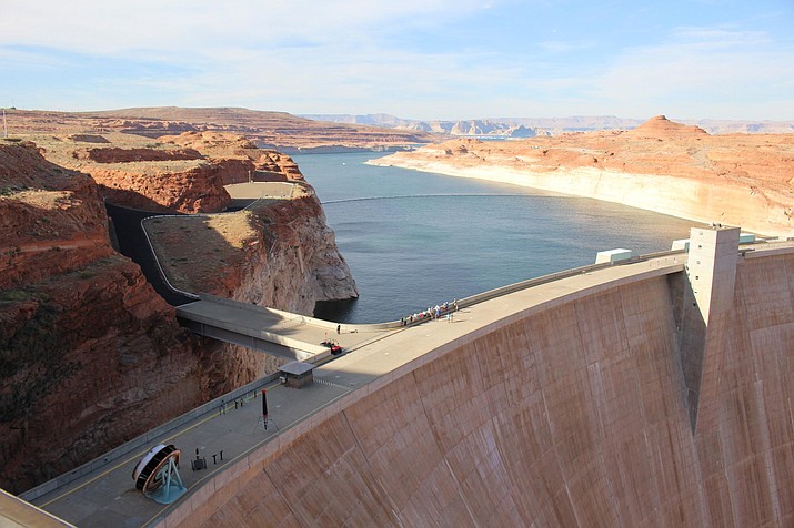 Lake Powell stores Colorado River water behind Glen Canyon Dam, completed in 1966 near Page. After decades of drought and population growth, the reservoir is at less than half its capacity. (Luke Runyon/KUNC)