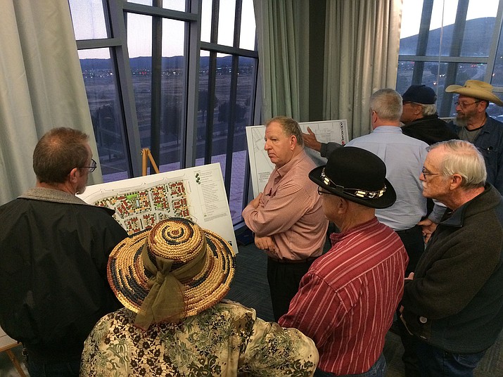 Residents speak with Dorn Homes personnel and contractors about a proposed development at the southeast corner of Long Look Drive and Glassford Hill Road during a neighborhood meeting Oct. 15 in the Prescott Valley Public Library. (Sue Tone/Tribune)